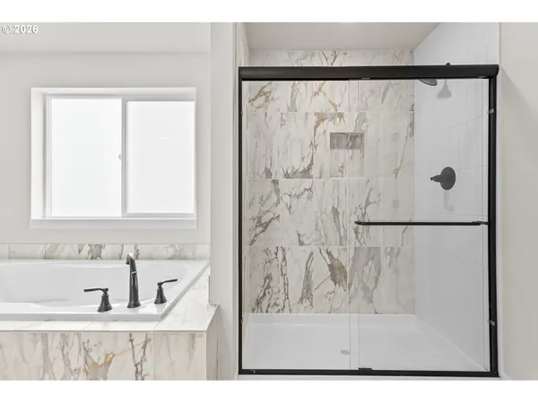 a view of a bathroom with a bathtub and a sink