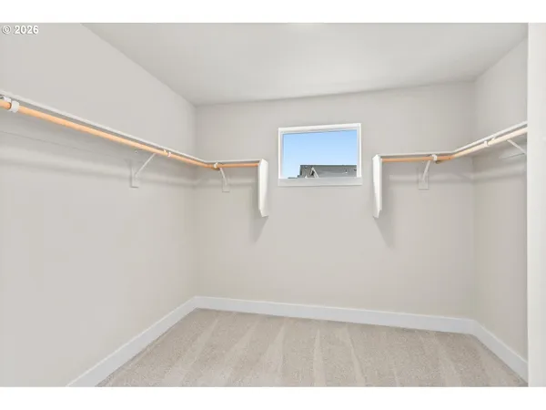 a view of an empty walk in closet