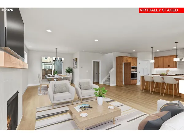 a living room with furniture and kitchen view