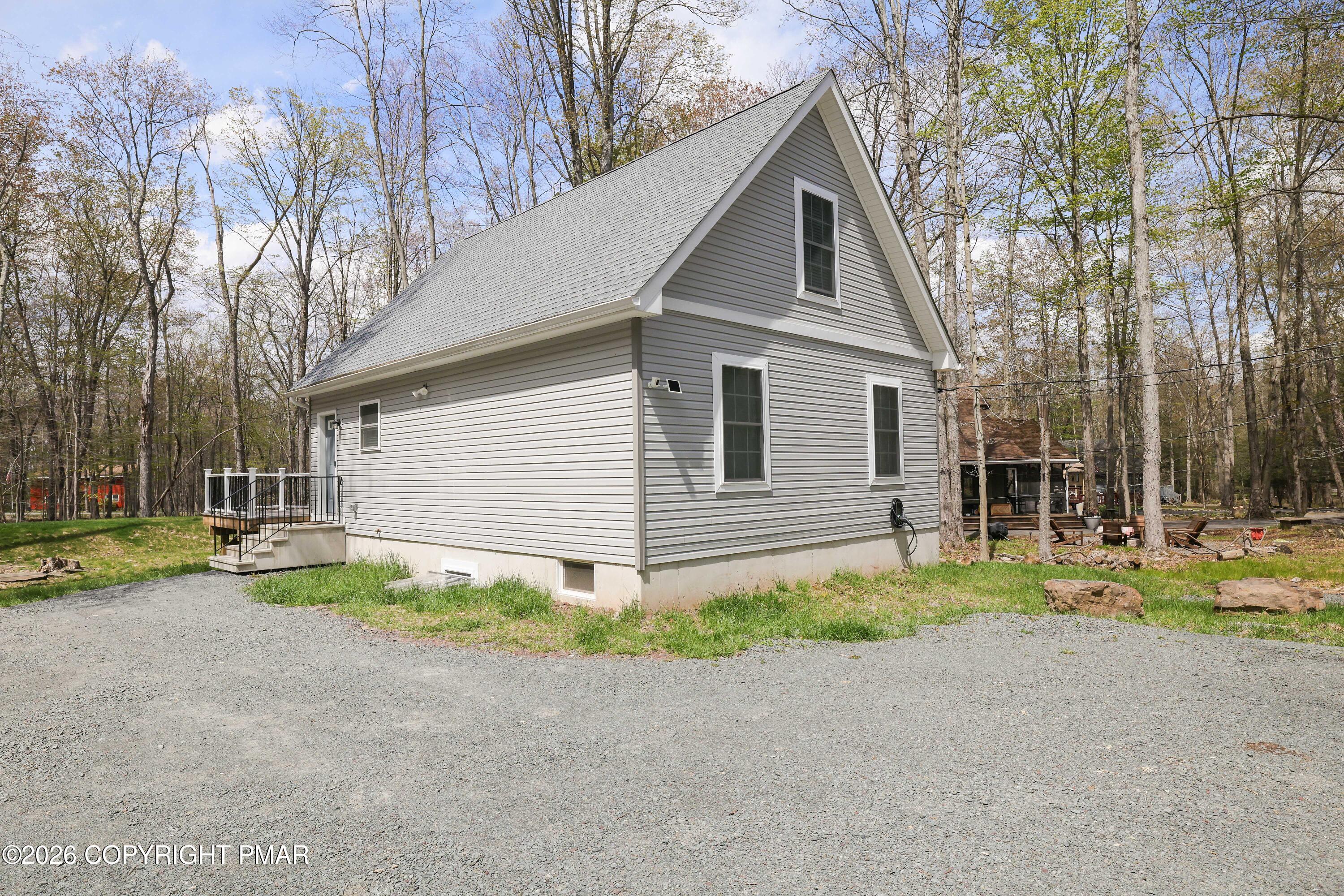 Lot 284 Mallard Lane Bushkill, PA 18324 - Photo 7 of 7 a view of a house with a yard and large trees