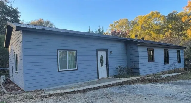 a view of a brick house with a large window