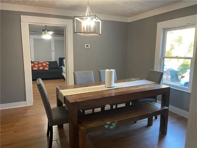 a view of a dining room with furniture window and wooden floor