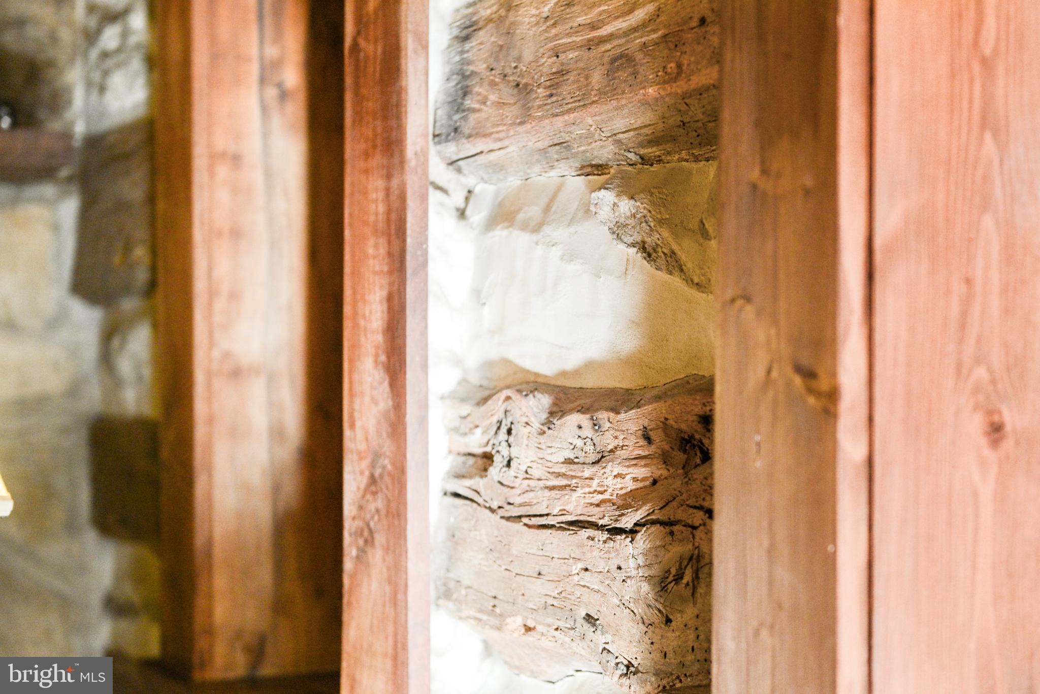 7144 Ira Sears Road Adamstown, MD 21710 - Photo 78 of 149 Log wall - Living Room