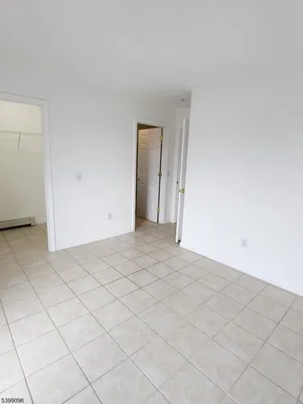 a view of an empty room and entryway