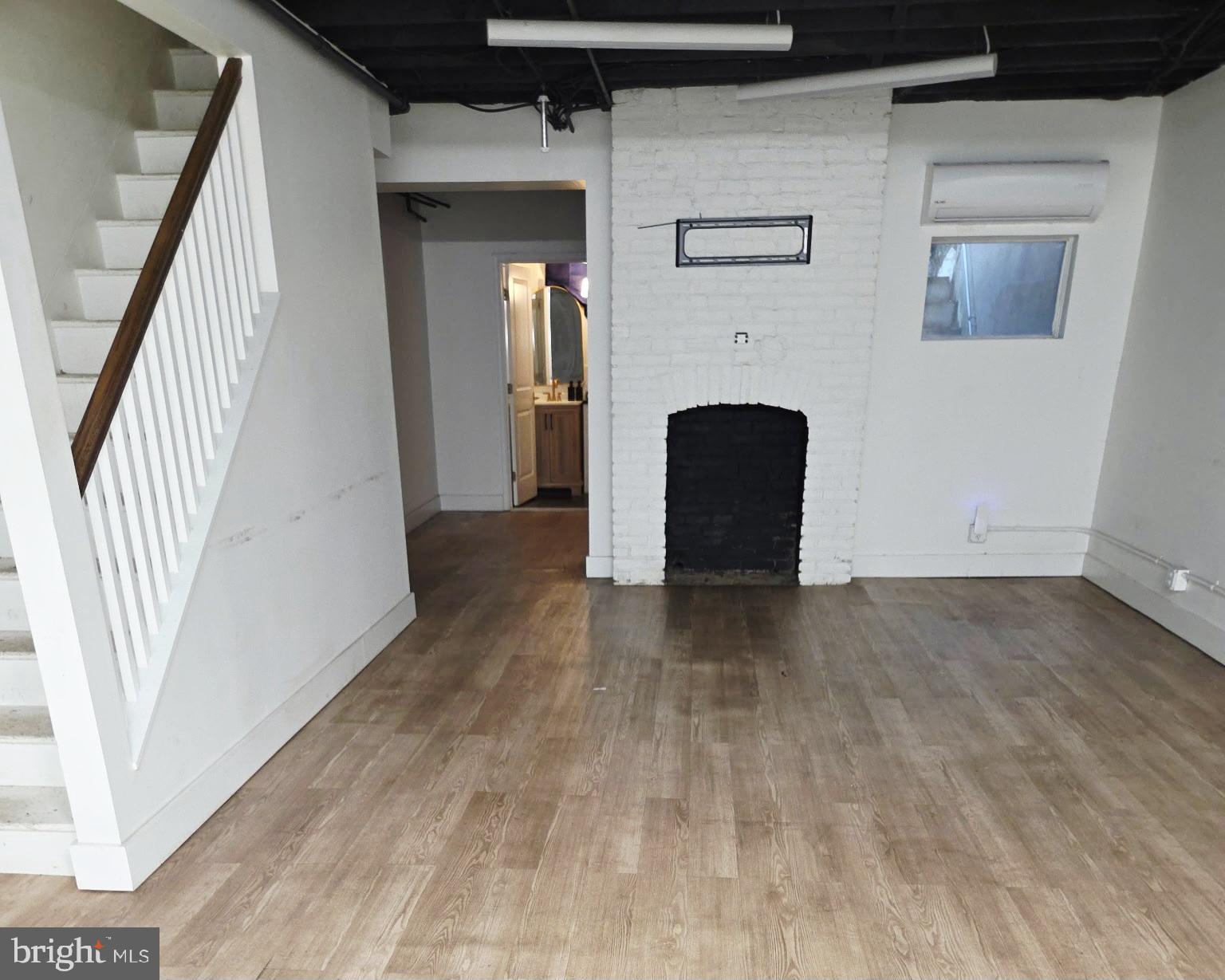 214 2nd Street Southeast Washington, DC 20003 - Photo 3 of 12 a view of a livingroom with wooden floor and staircase