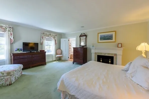 a bed room with a bed and a television