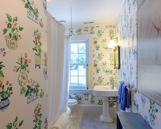 31 Lamberts Cove Road Tisbury, MA 02568 - Photo 23 of 35 a bath room with a bathtub and potted plant