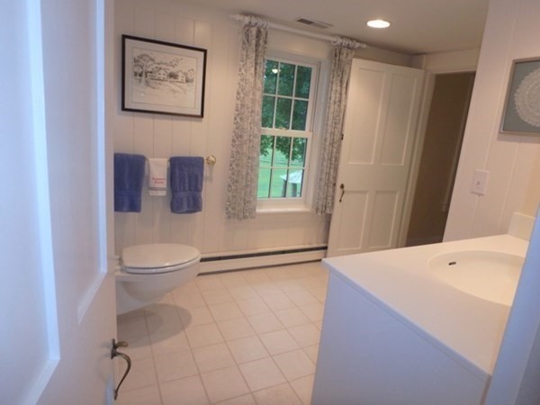 31 Lamberts Cove Road Tisbury, MA 02568 - Photo 25 of 35 a hallway with a washer and dryer