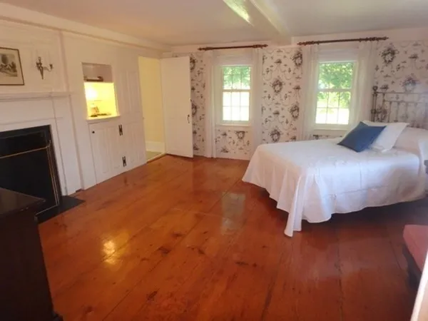 a bedroom with a bed and window