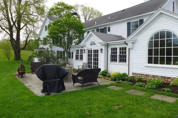 31 Lamberts Cove Road Tisbury, MA 02568 - Photo 28 of 35 a view of a house with backyard sitting area and garden