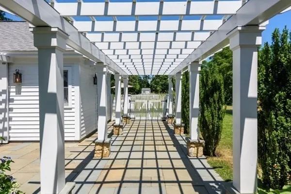 a view of a house with swimming pool and sitting area