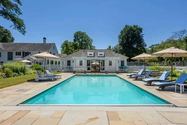 a kitchen with sink refrigerator and cabinets