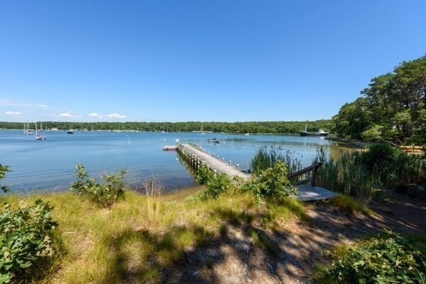 31 Lamberts Cove Road Tisbury, MA 02568 - Photo 35 of 35 a view of a lake with houses in the back