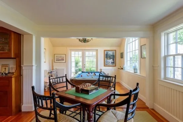 a dining room with furniture and windows