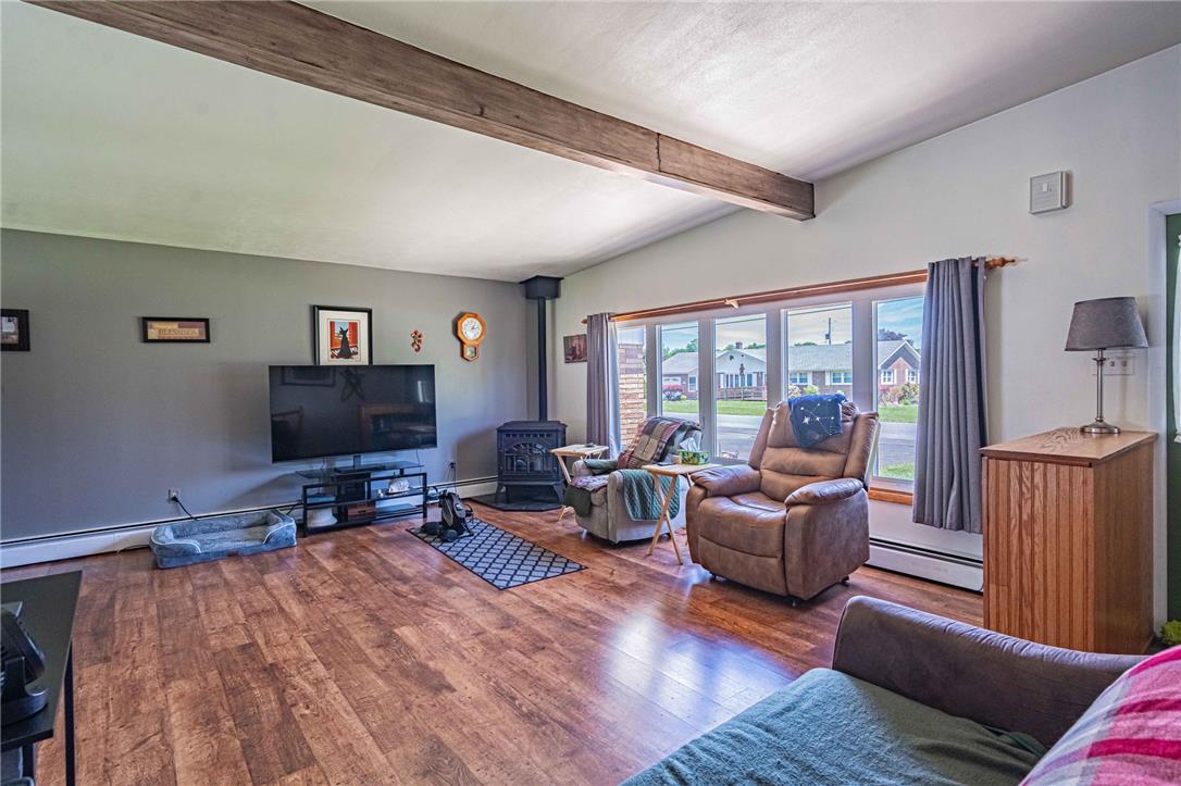 579 Cherry Road Northampton, PA 18067 - Photo 12 of 57 Exposed wood beams accentuate the ceilings in this generously proportioned living space.