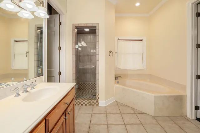 a spacious bathroom with a bathtub sink and a shower