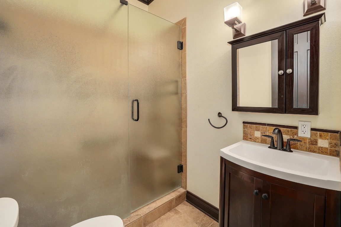 3900 Shell Road Georgetown, TX 78628 - Photo 26 of 40 a bathroom with a sink and mirror