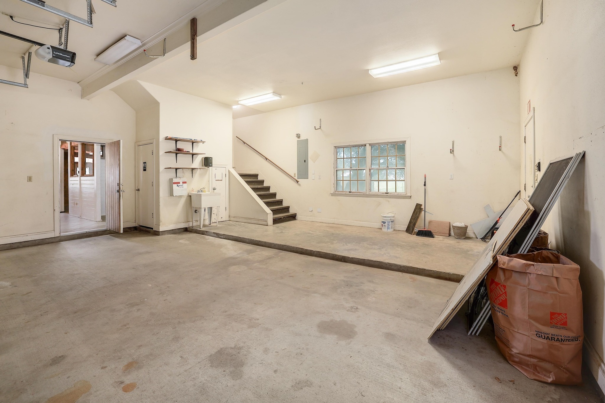 3900 Shell Road Georgetown, TX 78628 - Photo 31 of 40 Garage with electric panel and a garage door opener