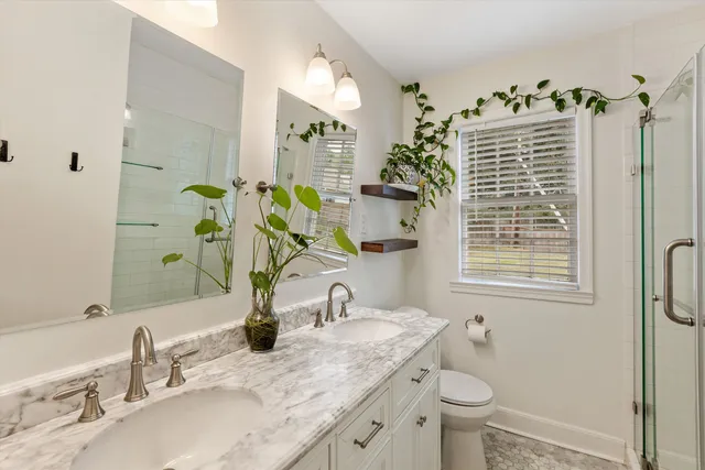 a bathroom with a shower and a sink