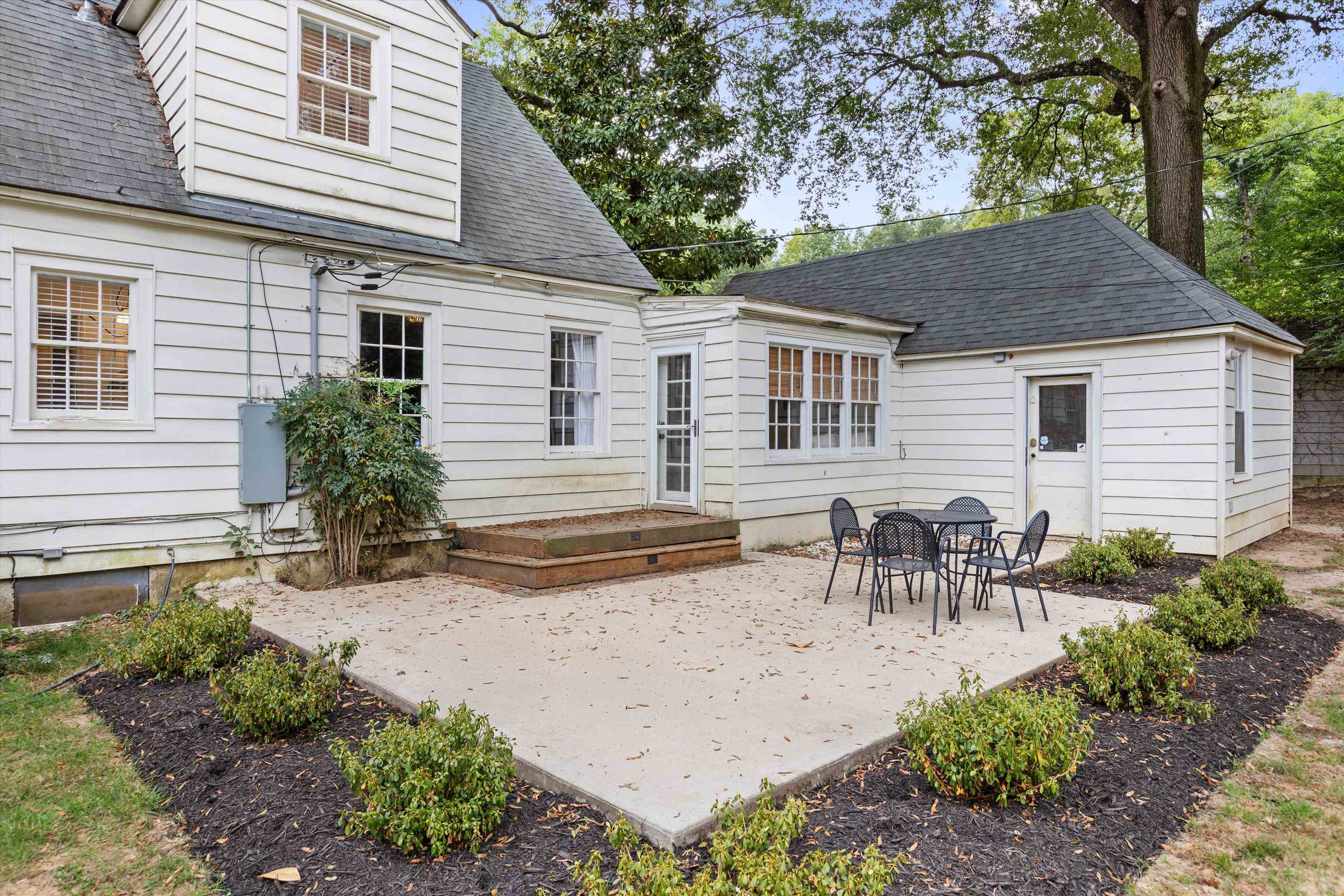 165 Picardy Street Memphis, TN 38111 - Photo 23 of 28 a view of a house with patio and a garden