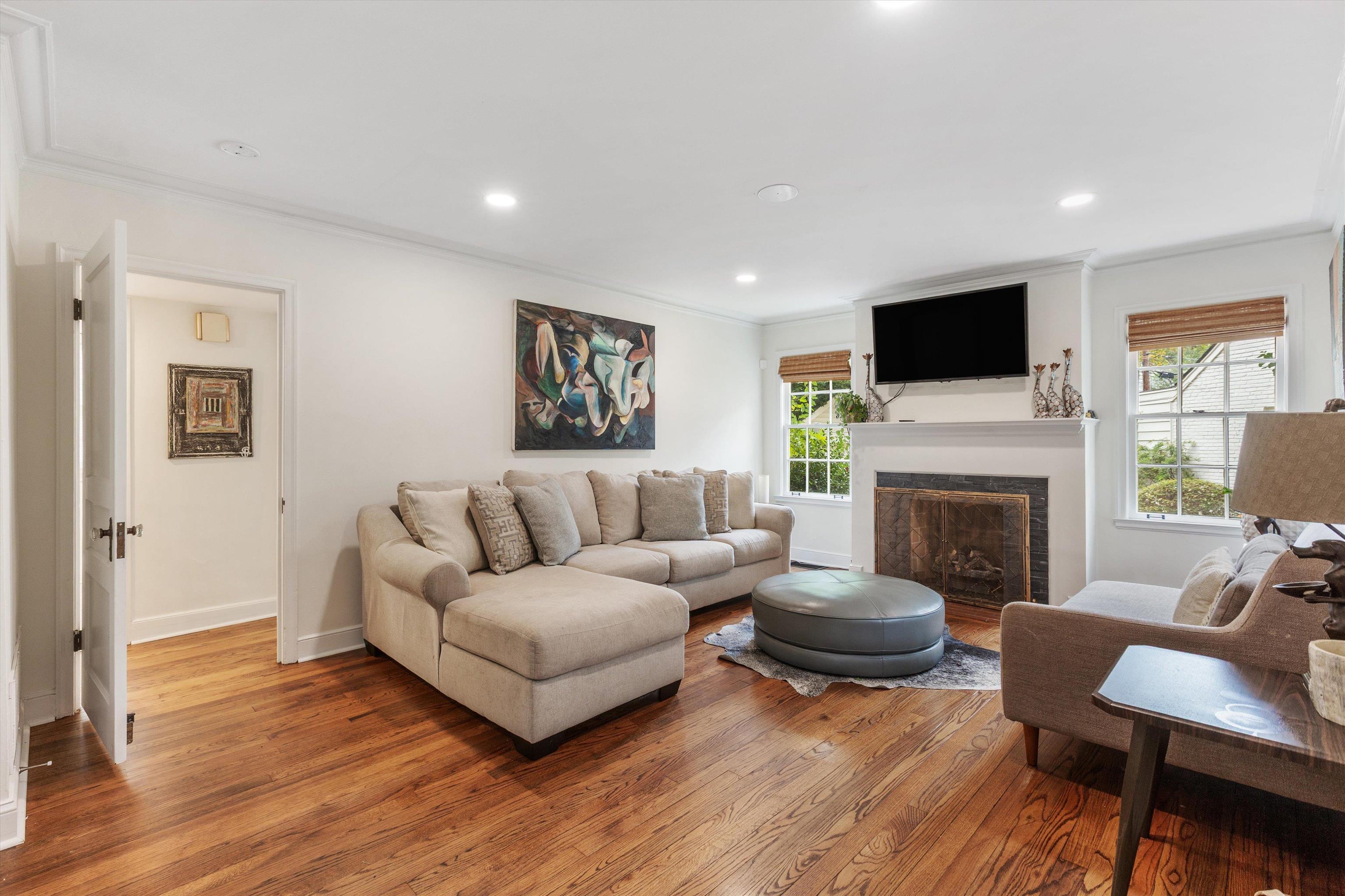 165 Picardy Street Memphis, TN 38111 - Photo 3 of 28 a living room with furniture a flat screen tv and a fireplace