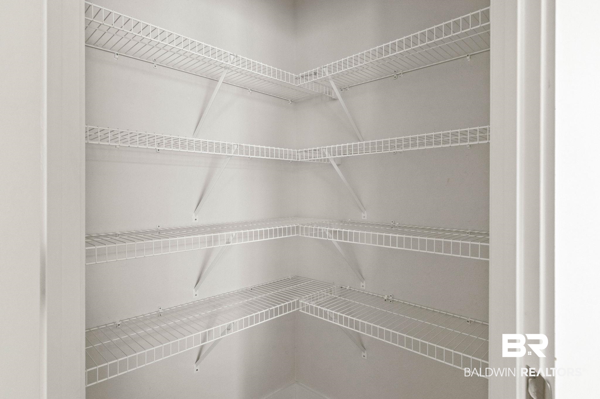 1710 Grouse Street Foley, AL 36535 - Photo 36 of 76 Corner pantry with five tiers of white wire shelving