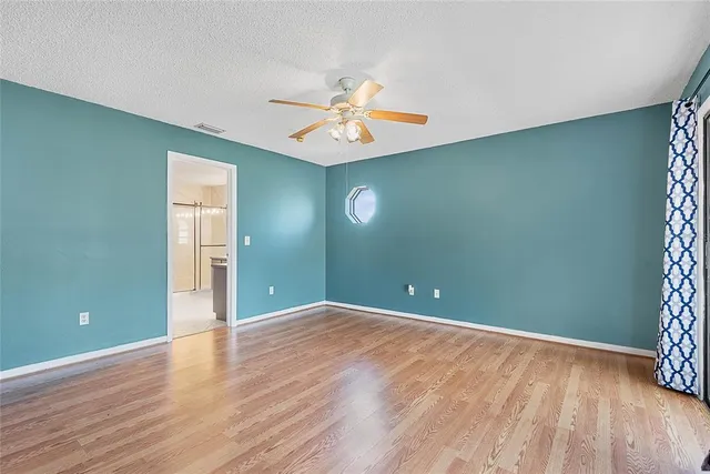 a bathroom with a sink shower and a mirror