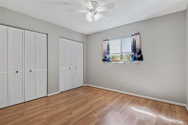 a bathroom with a sink double vanity granite and a mirror