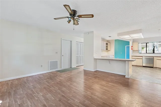 a kitchen with stainless steel appliances a refrigerator sink and stove