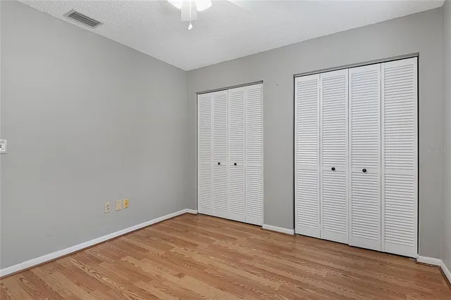 a view of room with window and ceiling fan