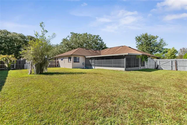a view of a city with green field