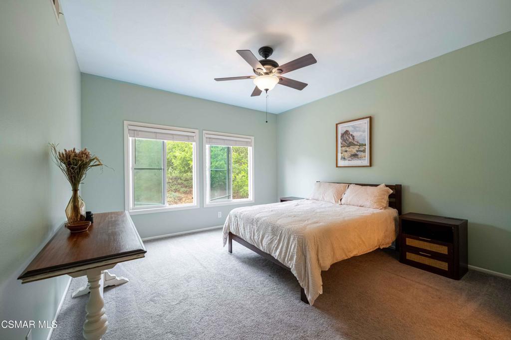 580 Fenwick Way, Unit C Simi Valley, CA 93065 - Photo 21 of 39 a bedroom with a bed and a window