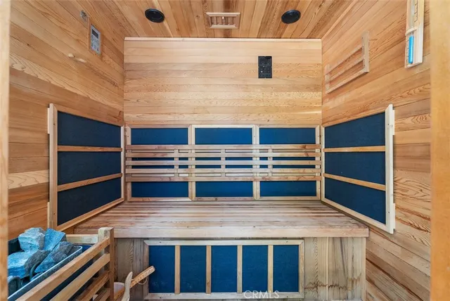 a view of kitchen with stainless steel appliances and cabinets