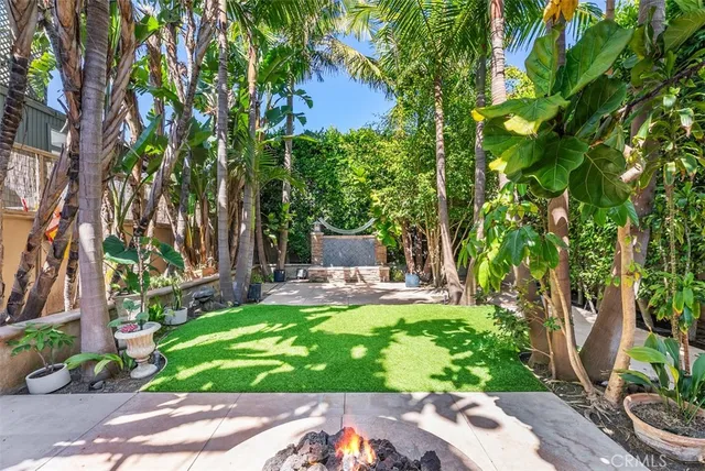 a view of a chair and table in the garden