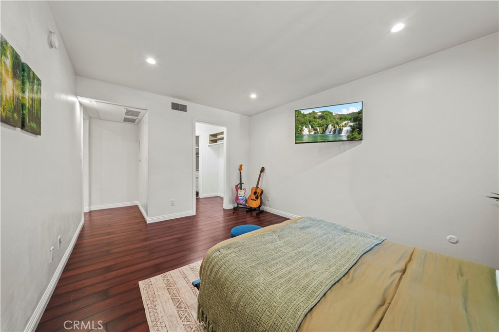 5215 Balboa Boulevard, Unit 203 Encino, CA 91316 - Photo 14 of 27 a bed room with a bed and a couch