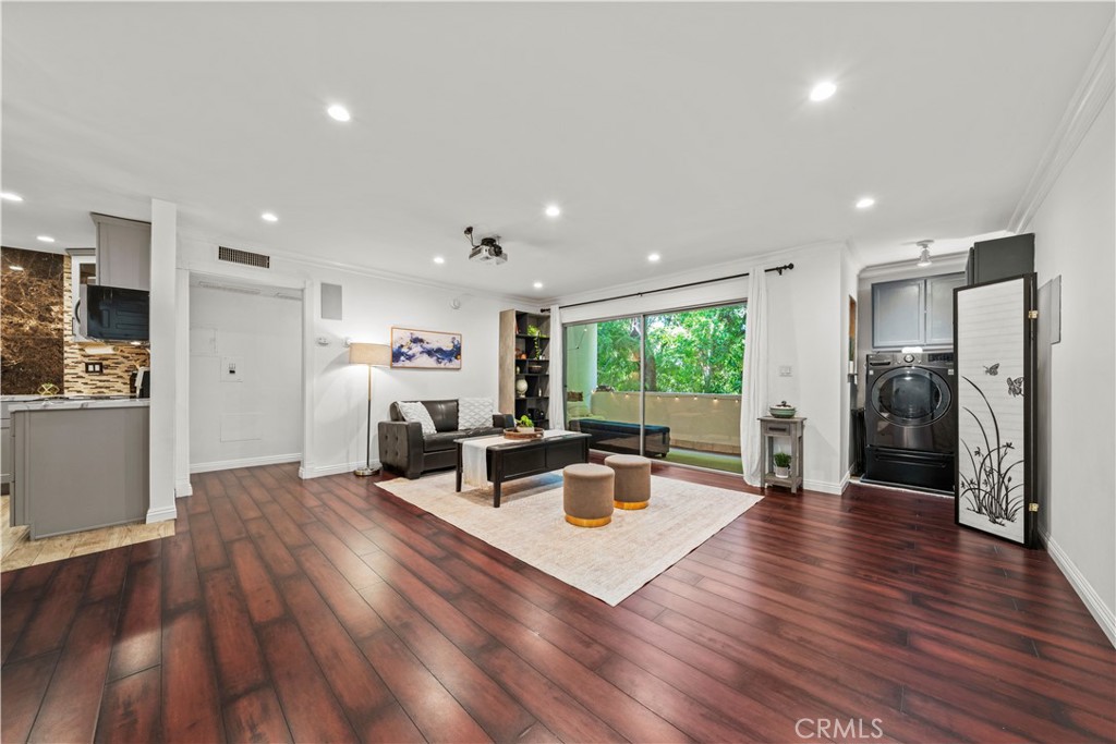 5215 Balboa Boulevard, Unit 203 Encino, CA 91316 - Photo 2 of 27 a living room with furniture wooden floor and a kitchen view