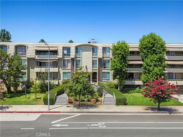 front view of a house with a garden