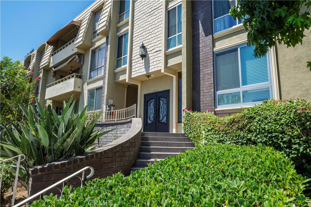 5215 Balboa Boulevard, Unit 203 Encino, CA 91316 - Photo 27 of 27 a view of a house with large windows and plants
