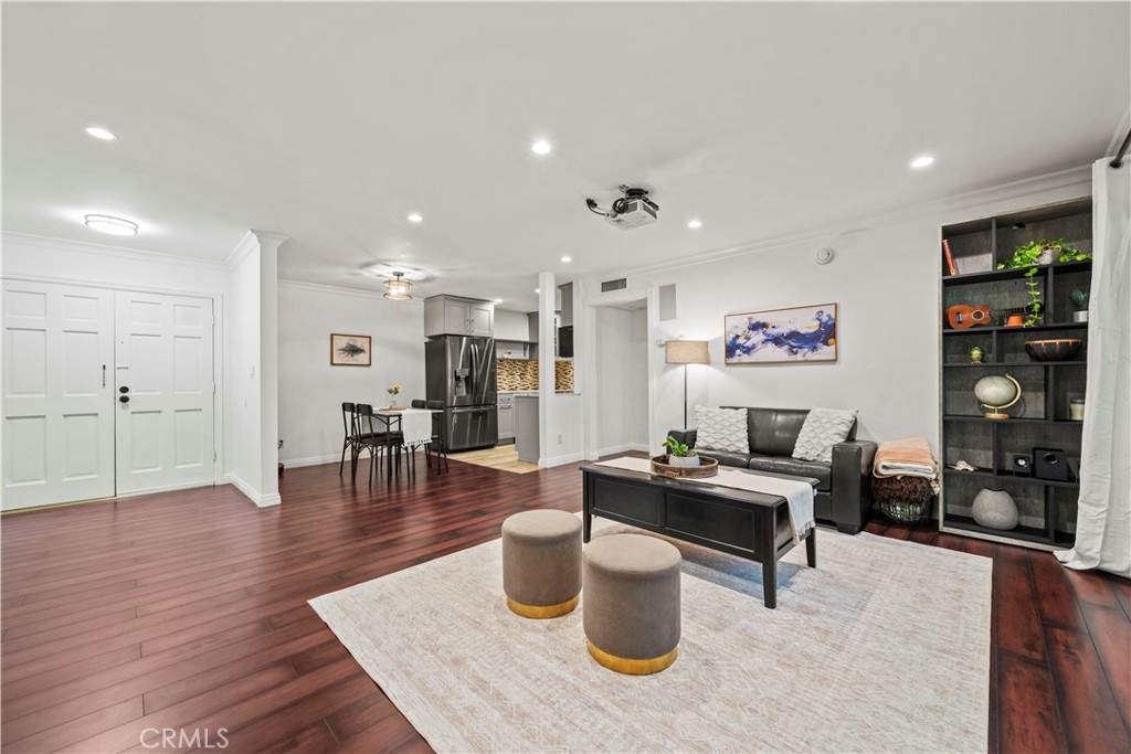 5215 Balboa Boulevard, Unit 203 Encino, CA 91316 - Photo 3 of 27 a dining room with wooden floor and furniture