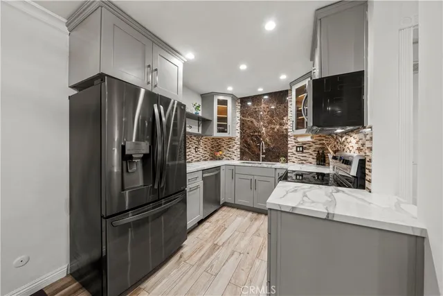 a kitchen with a refrigerator sink and microwave