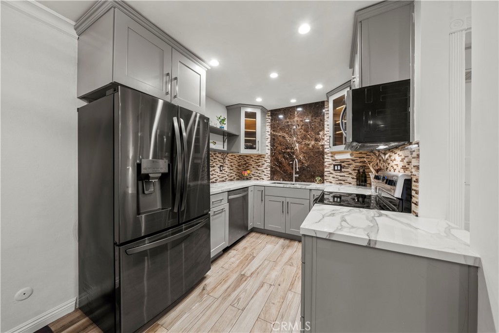 5215 Balboa Boulevard, Unit 203 Encino, CA 91316 - Photo 6 of 27 a kitchen with a refrigerator sink and microwave