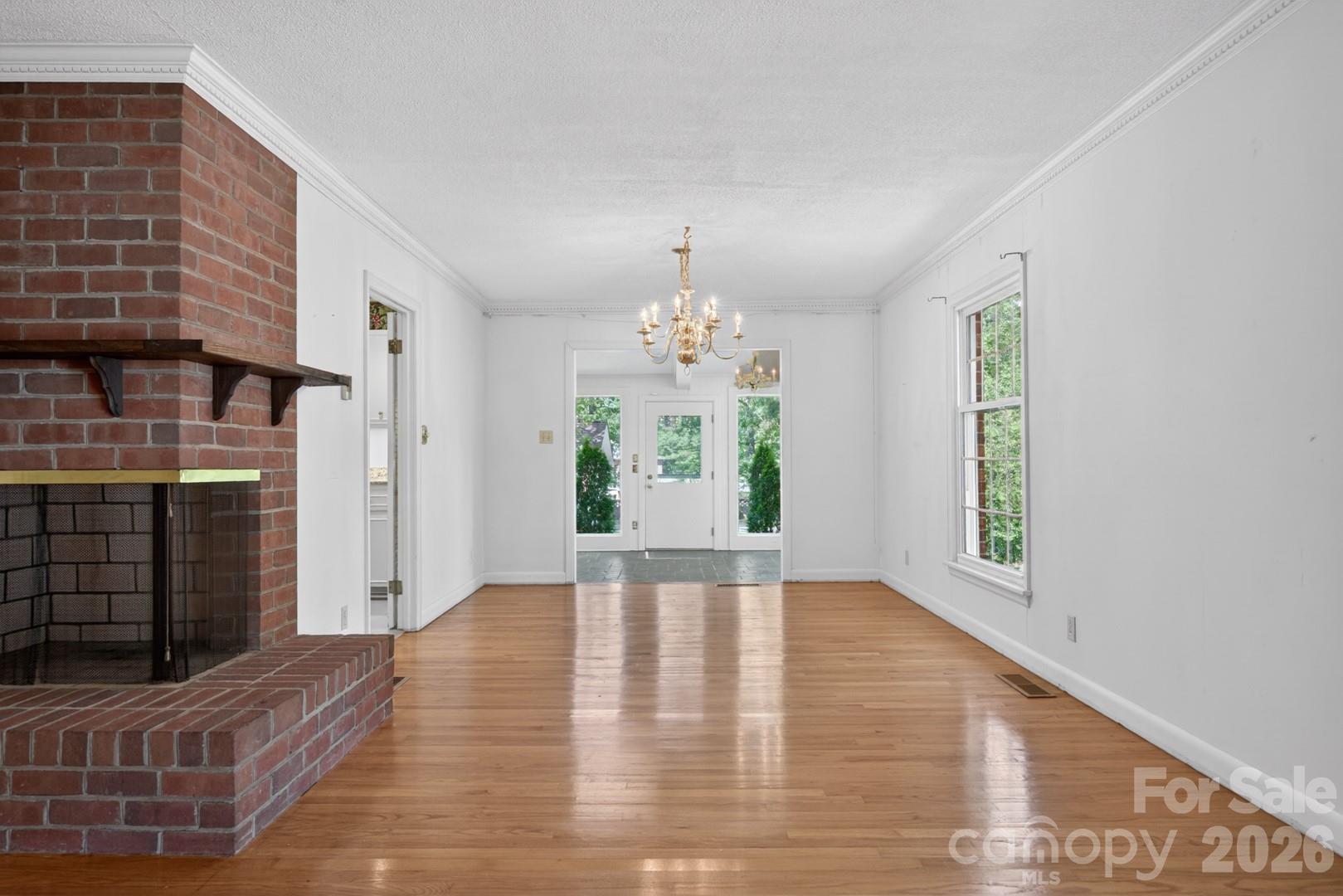 236 Richmond Road Salisbury, NC 28144 - Photo 14 of 48 a view of an empty room with window and hardwood floor