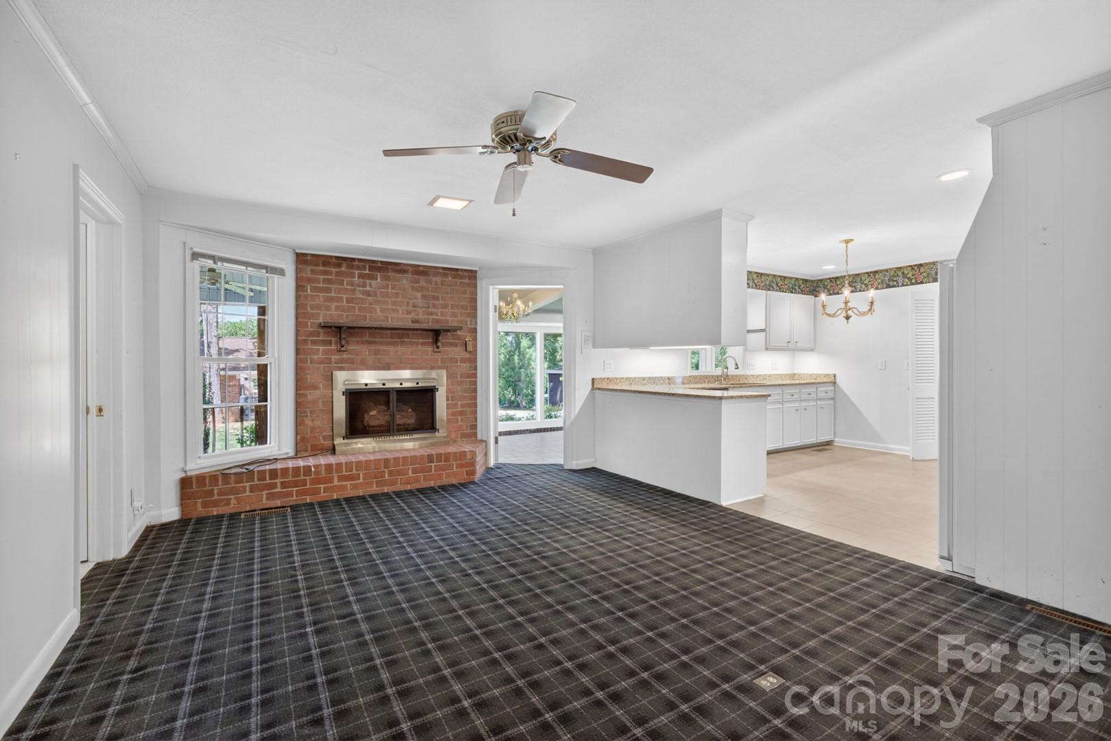 236 Richmond Road Salisbury, NC 28144 - Photo 23 of 48 a view of a kitchen with a sink a fireplace and a window