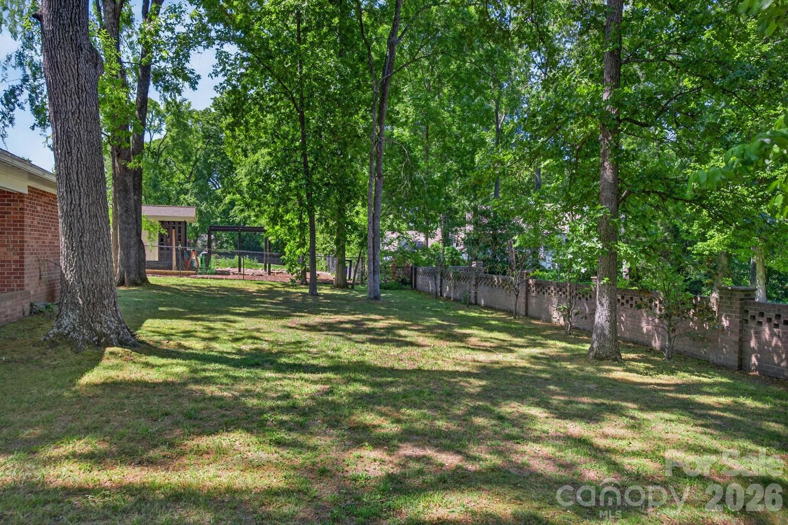 236 Richmond Road Salisbury, NC 28144 - Photo 37 of 48 a view of a backyard with a small cabin