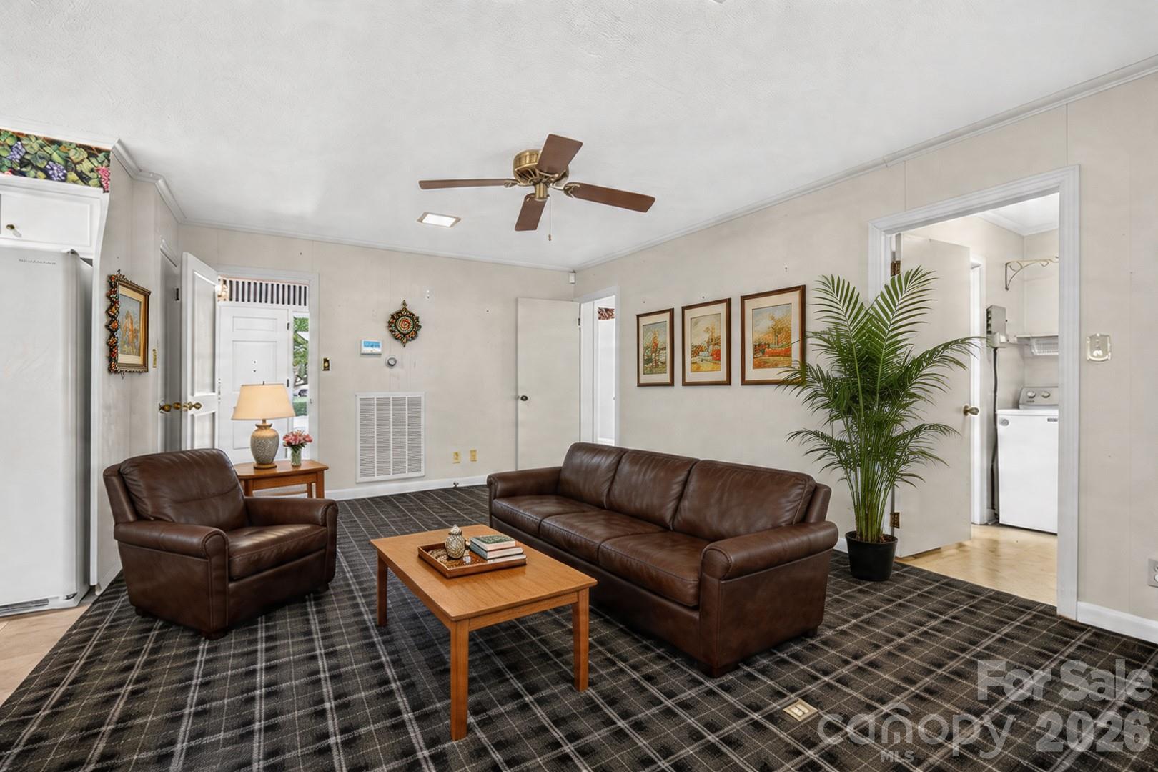 236 Richmond Road Salisbury, NC 28144 - Photo 38 of 48 a living room with furniture and a potted plant