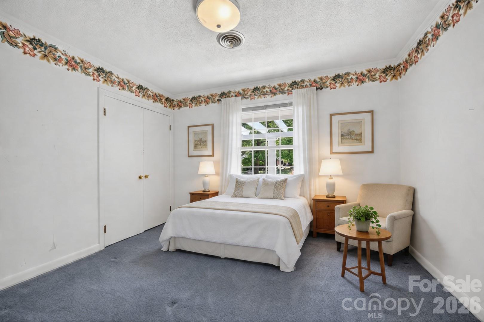 236 Richmond Road Salisbury, NC 28144 - Photo 40 of 48 a bedroom with a bed and a chandelier