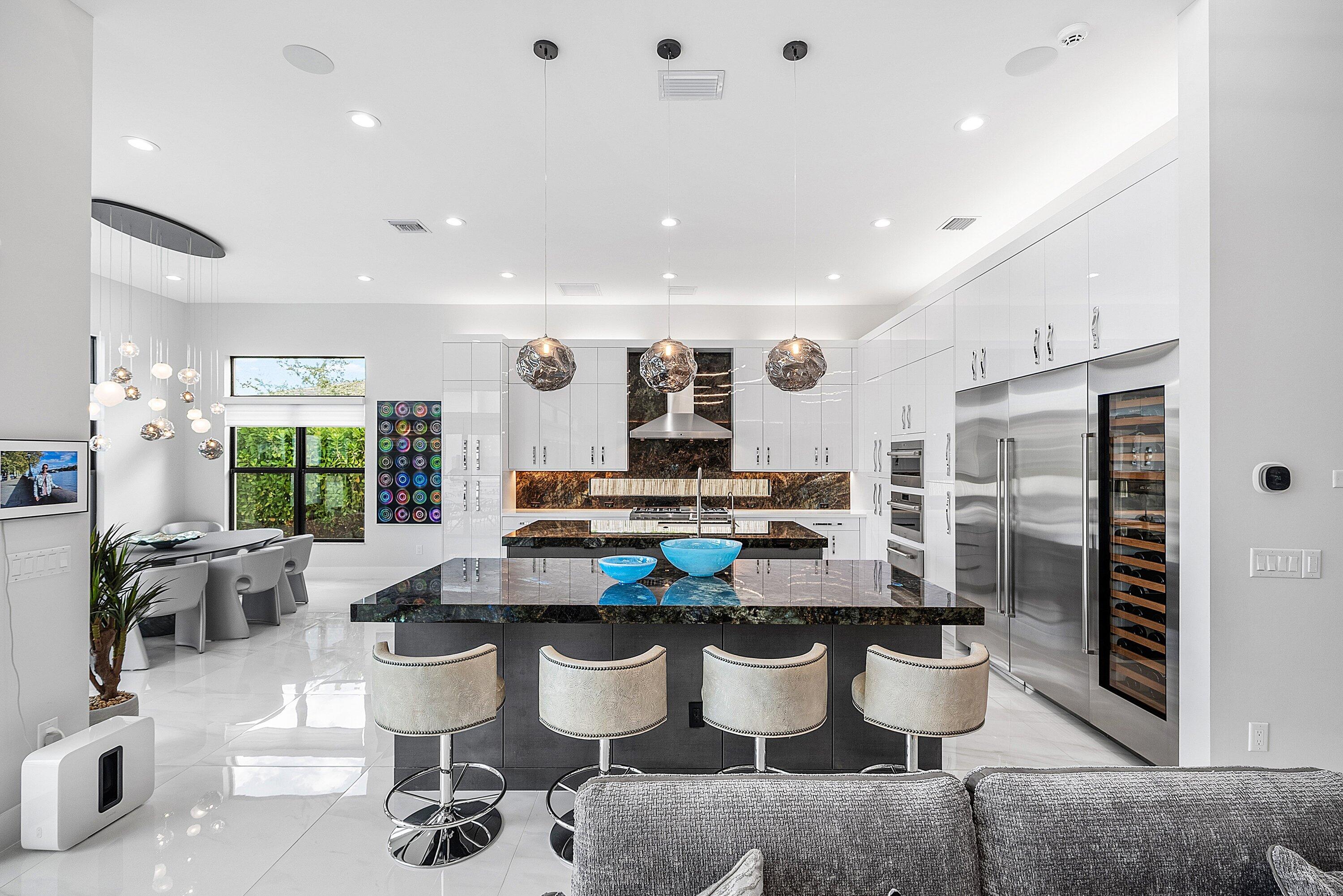 9569 Vescovato Way Boca Raton, FL 33496 - Photo 11 of 98 a large kitchen with a table and chairs