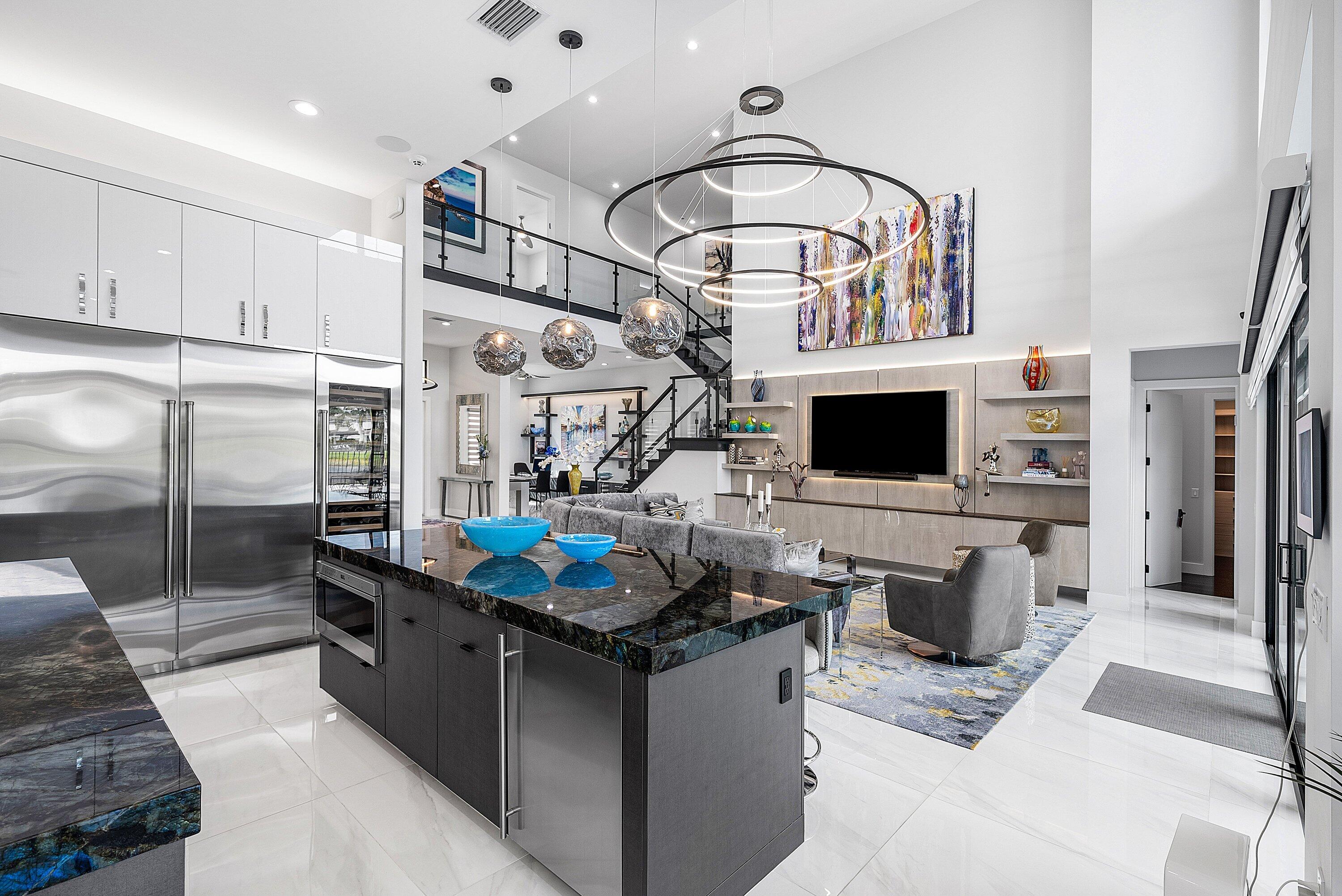 9569 Vescovato Way Boca Raton, FL 33496 - Photo 16 of 98 a kitchen with stainless steel appliances kitchen island granite countertop a sink and a refrigerator