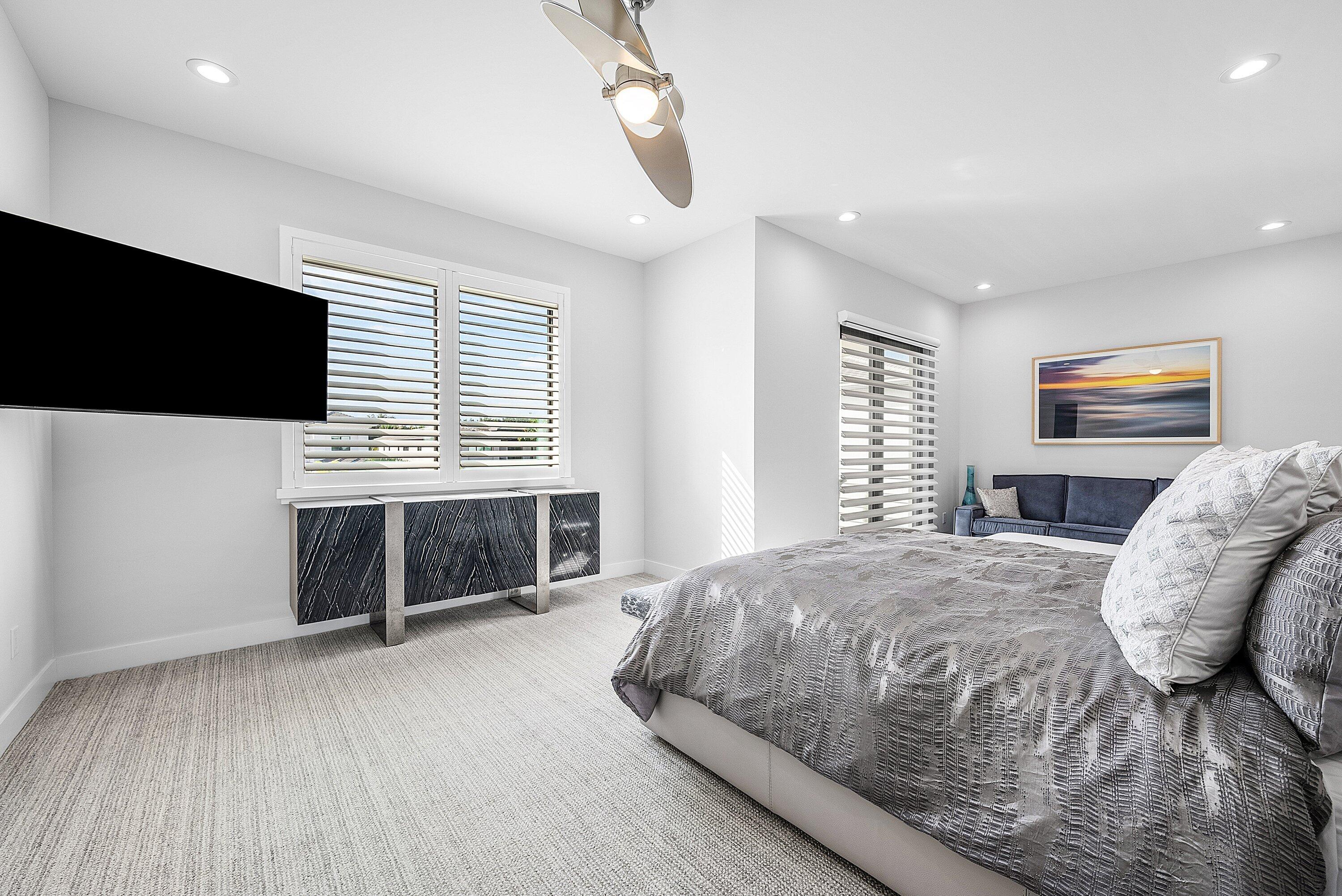 9569 Vescovato Way Boca Raton, FL 33496 - Photo 27 of 98 a bedroom with a bed and a flat screen tv