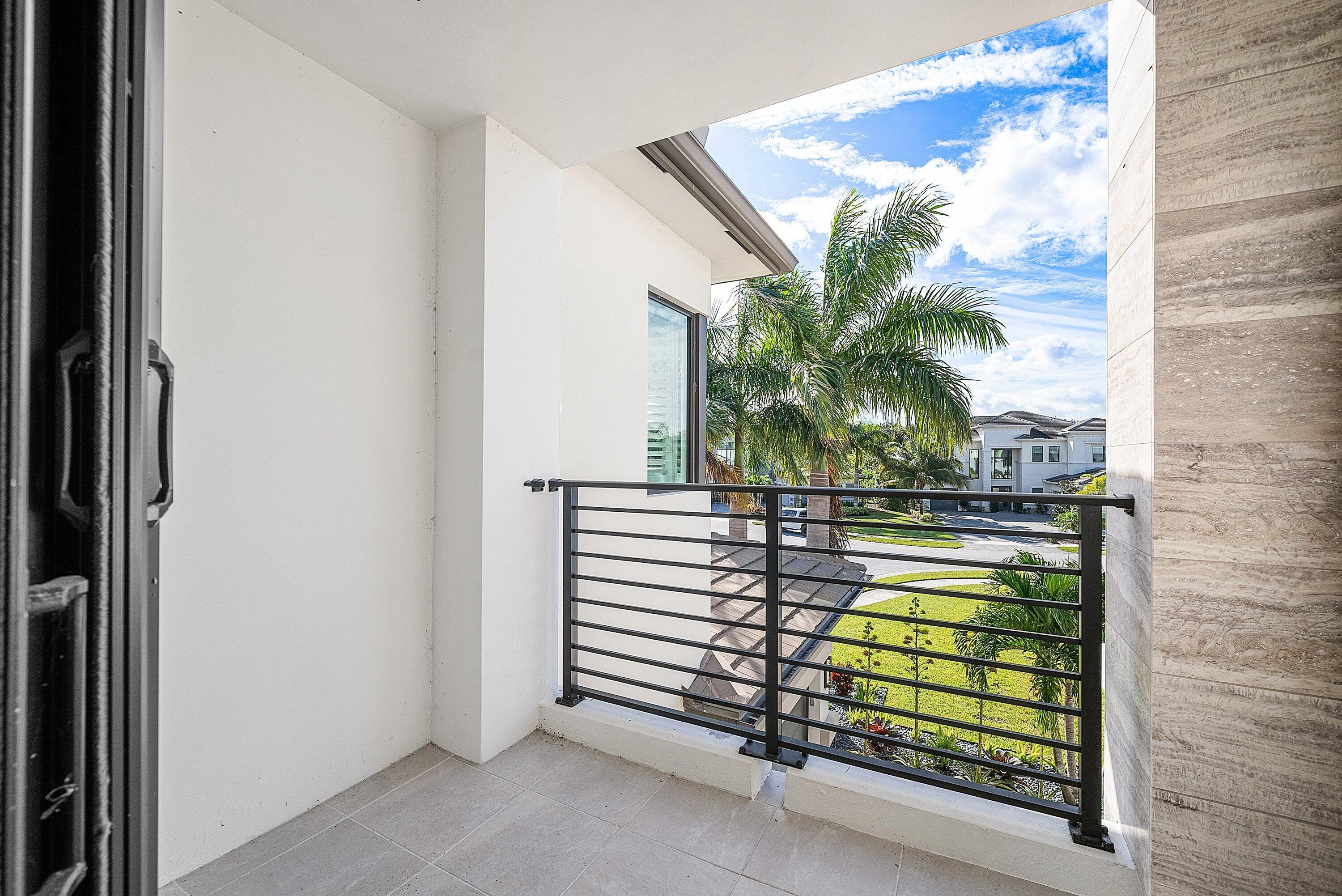 9569 Vescovato Way Boca Raton, FL 33496 - Photo 44 of 98 a view of a floor to ceiling window and potted plants